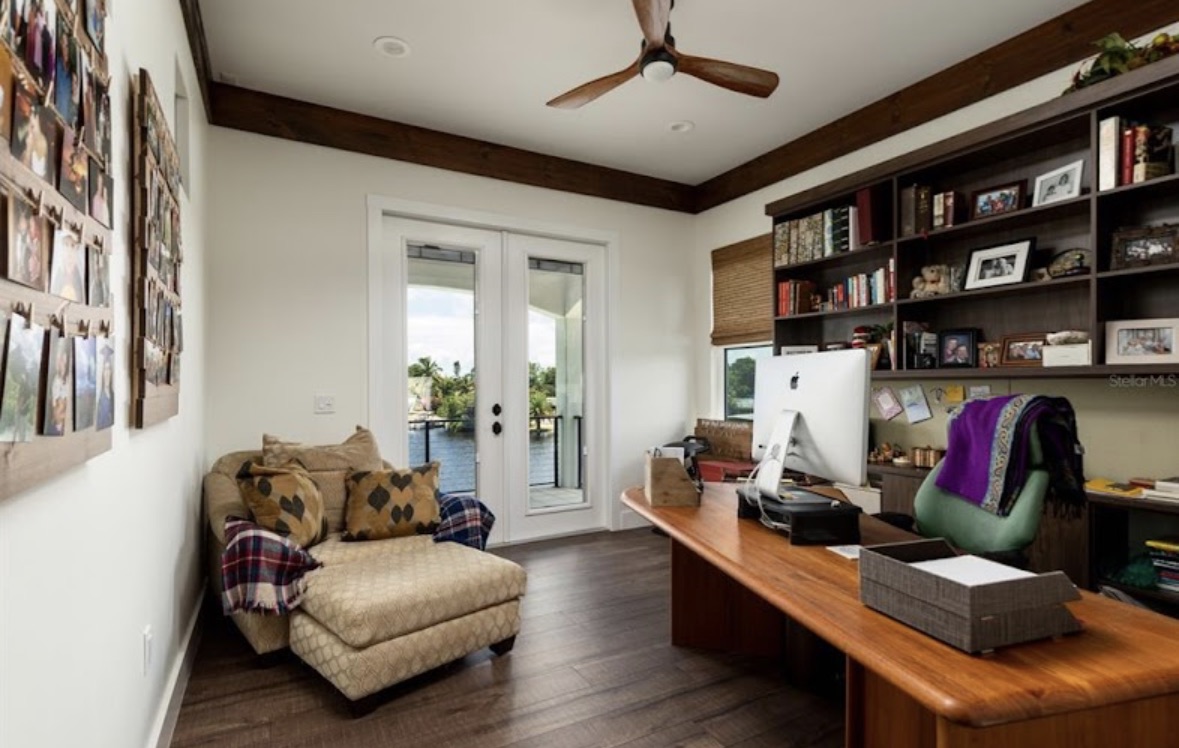 Home office with built-in shelving and water views