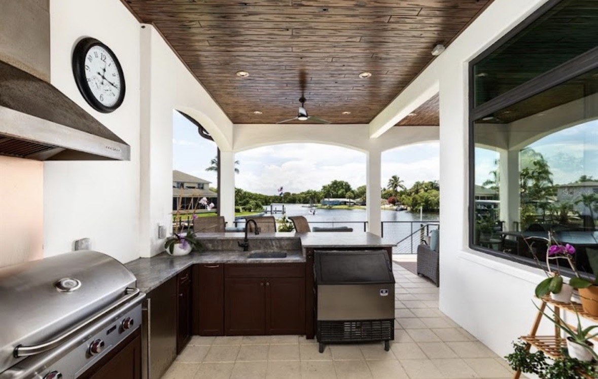 Covered outdoor kitchen overlooking the water