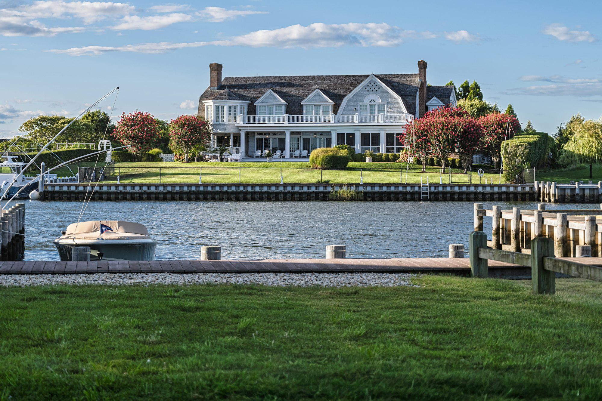 Waterfront home with a private dock at golden hour